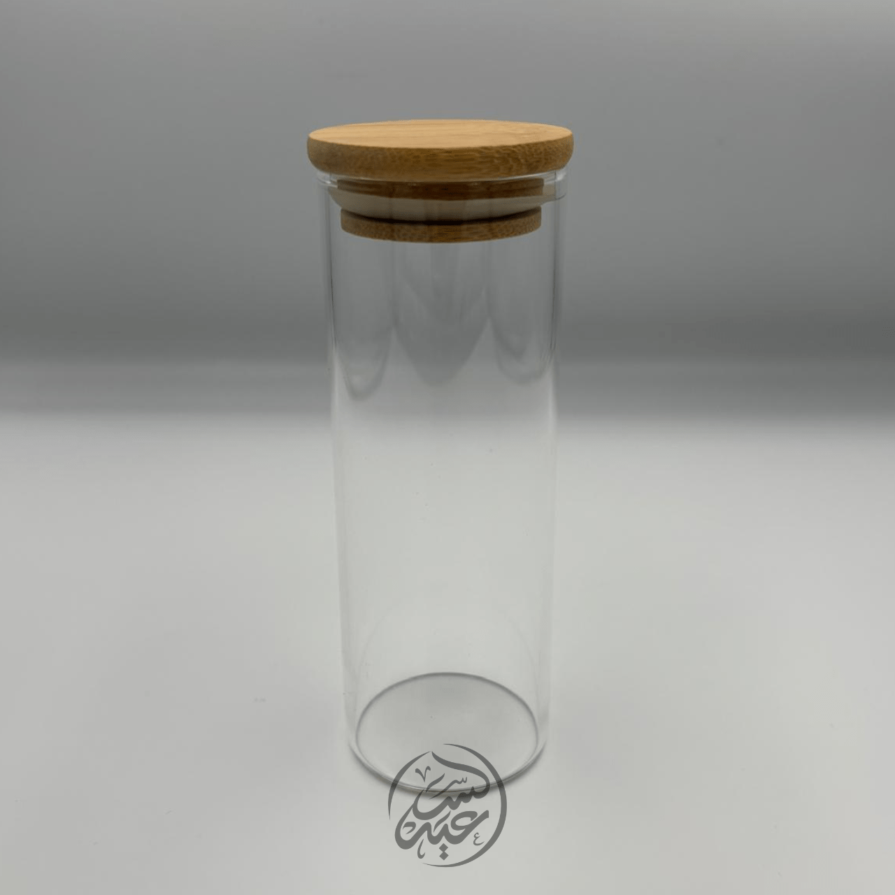 Glass container with a wooden lid علبة زجاجية مع غطاء خشبي - بهارات و عطارة السعيد