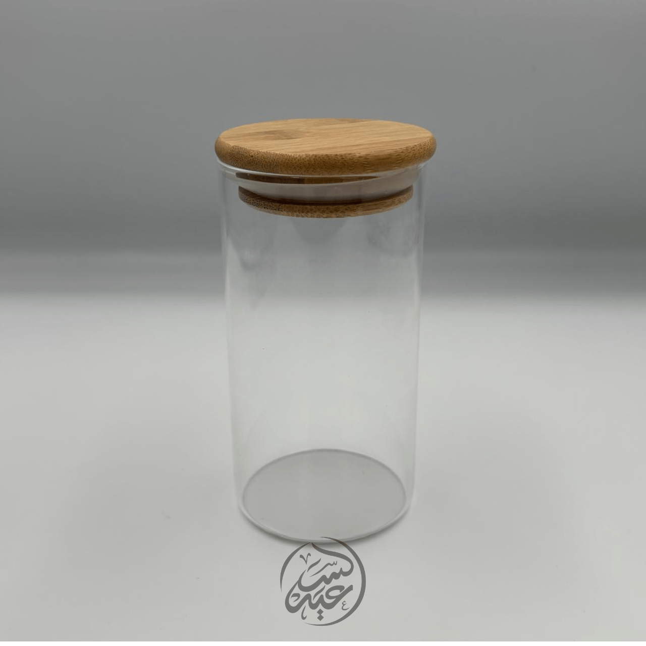 Glass container with a wooden lid علبة زجاجية مع غطاء خشبي - بهارات و عطارة السعيد